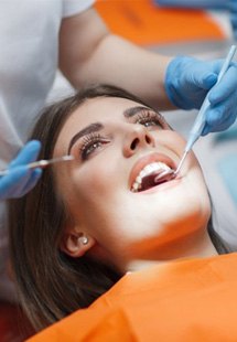 a patient getting dental care near Denison