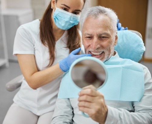 Smiling man enjoying the benefits of dental implants