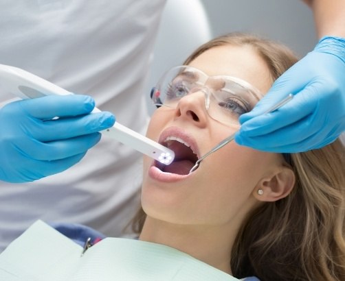 Dentist using intraoral camera to capture smile images