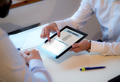 Patient looking at dental insurance form on tablet