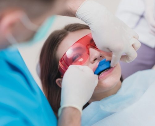 Dental patient receiving fluoride treatment