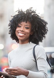 a woman smiling with bright teeth