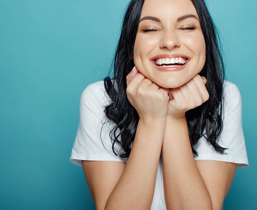 Smiling woman on a blue background