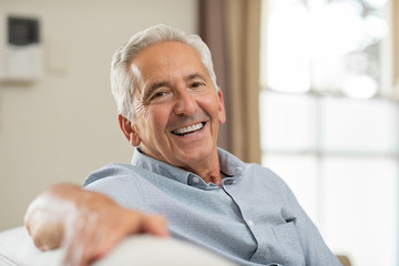 older person with dentures smiling