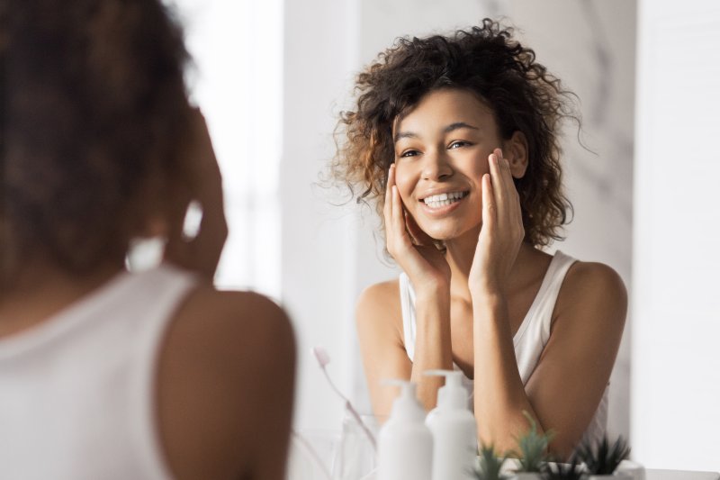 Patient smiling after their cosmetic dentistry treatment