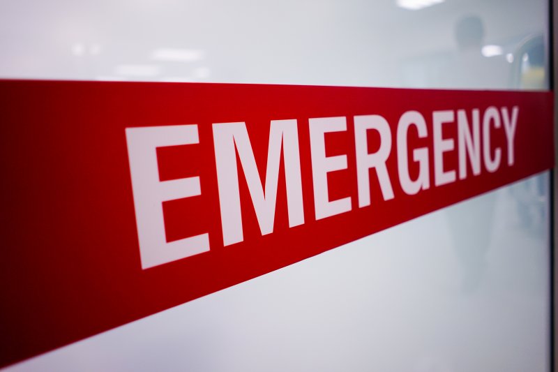 A large red emergency room sign
